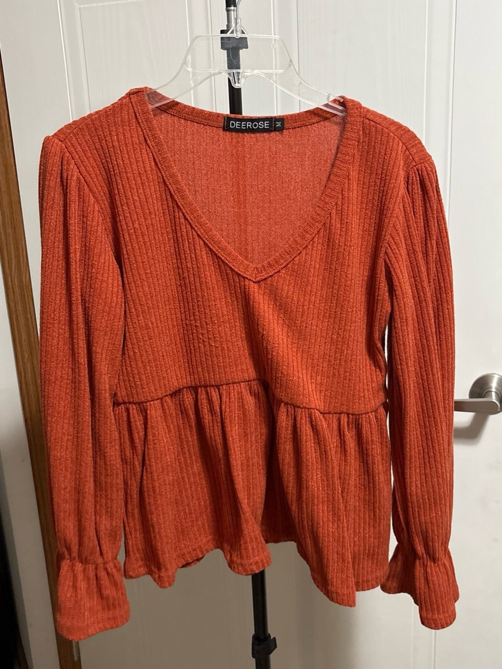 Rust Ribbed V-Neck Peplum Top